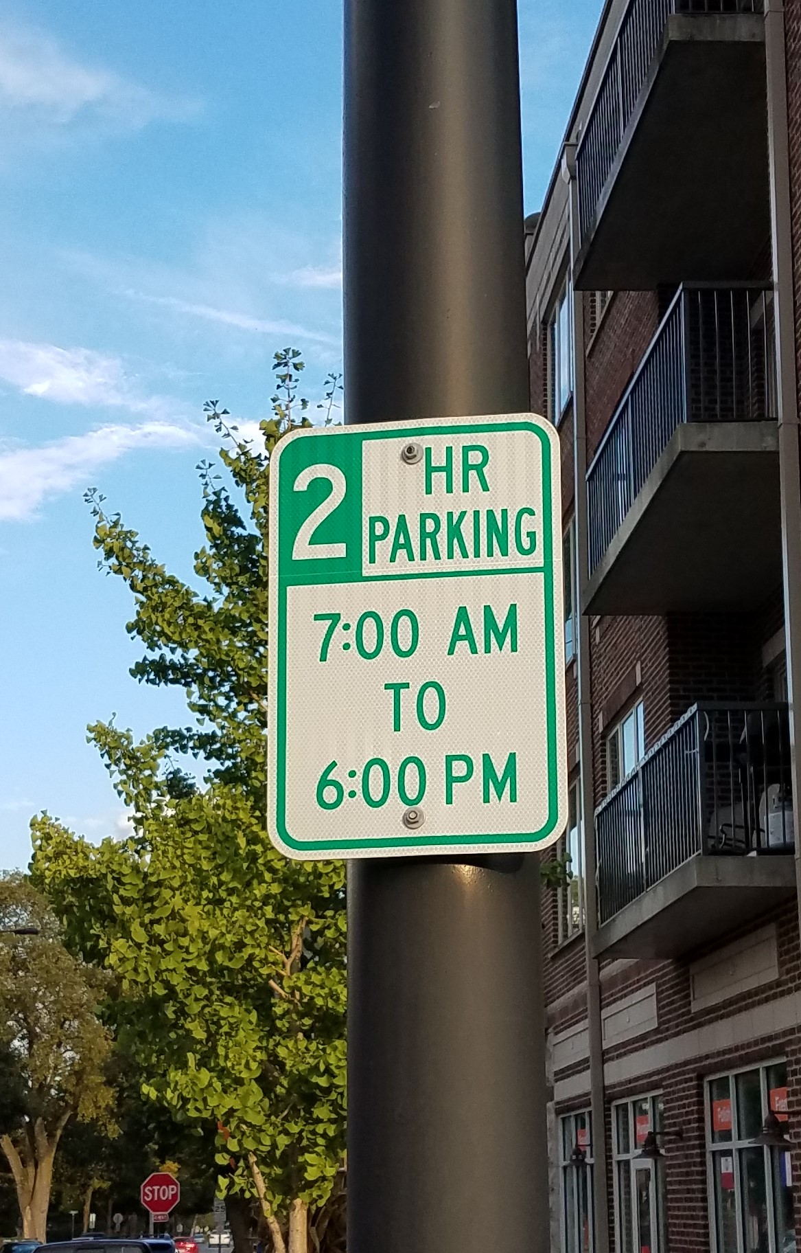 A parking sign mounted on a pole